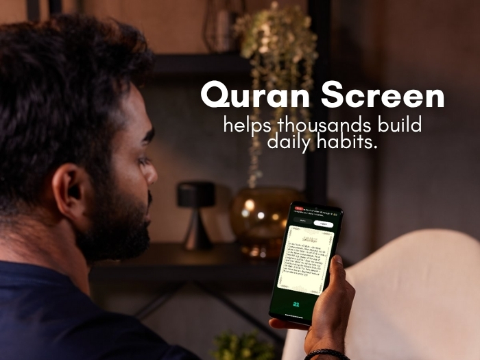 Person reading Quran on QuranScreen app